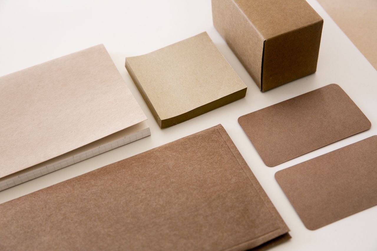 services-02 Explore a minimalist arrangement of brown paper stationery, perfect for office and business environments.